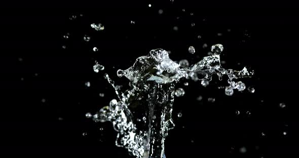 Water Exploding and Splashing against Black Background, Slow motion 4K