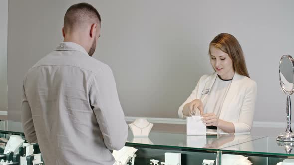 Customer Buying Perfect Gift for His Lady in Luxury Shop