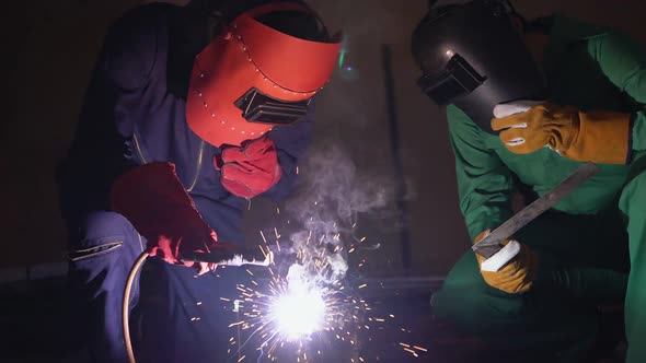 Metal Welder Working with Arc Welding Machine