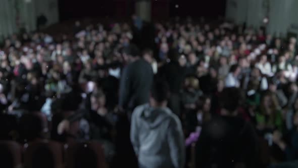 Blurred People Inside a Cinema Hall. Fast Motion.