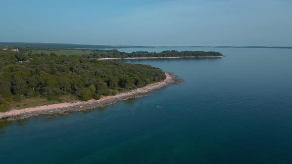 Idyllic Croatia Istria coast with clear blue, turquoise seaside water at a natural beach coast bay i