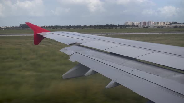 The Plane Travels on the Ground. View From the Airplane Window To the Wing.