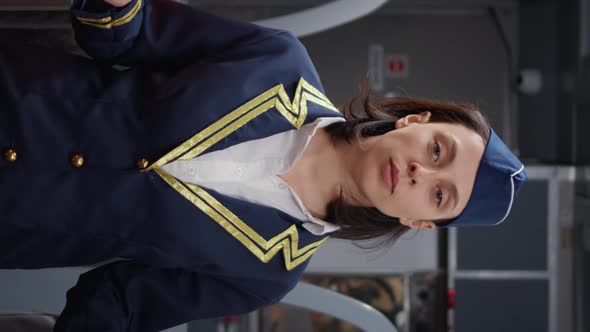 Vertical Video Portrait of Woman Stewardess in Aviation Uniform Boarding People