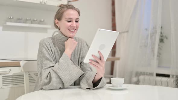 Young Woman Doing Video Chat on Tablet at Home