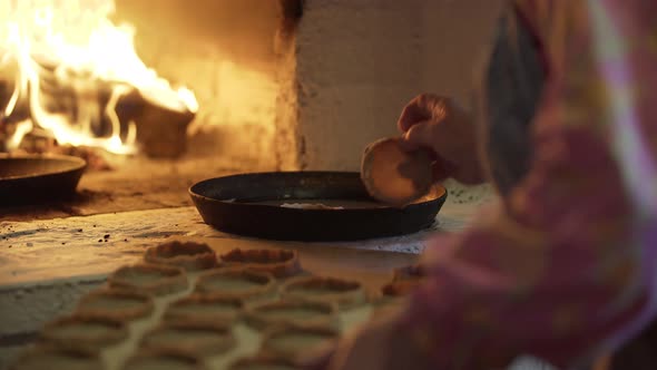 The Process of Baking Delicious Pies That Lie on Baking Tray in Hot Traditional Old Russian Stove