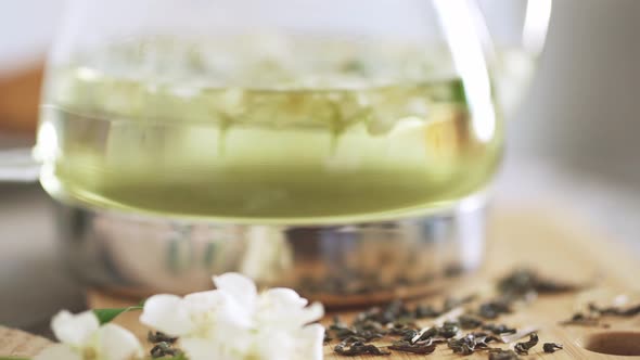 Jasmine Flower Tea For Breakfast At Home. Brewed Tea With Fresh Jasmine Flowers. Glassware For Tea