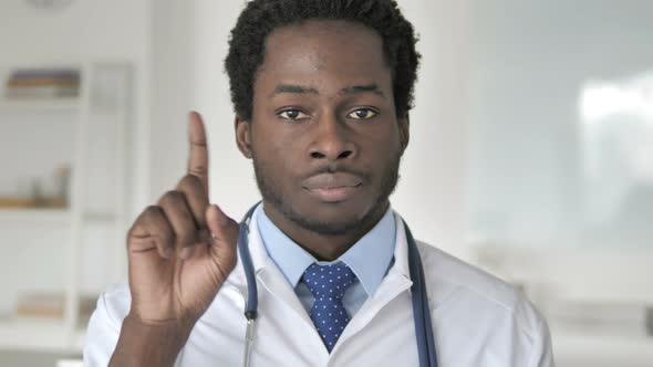 No By African Doctor, Waving Finger