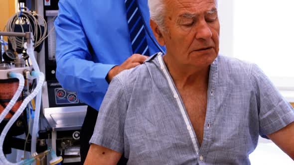 Male doctor examining a patient