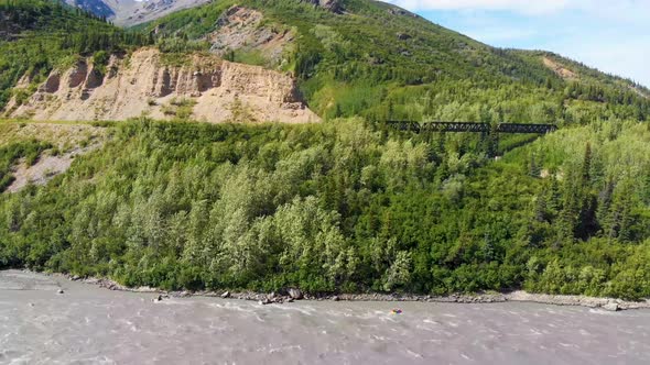 4K Drone Video of Kayaker on Chulitna River near Denali National Park and Preserve, AK during Summer