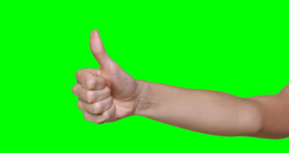 Hand of woman showing thumb up