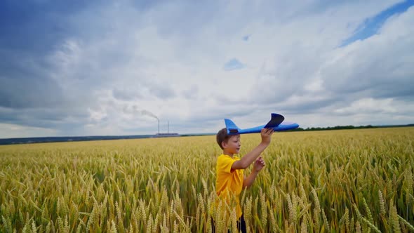 Little boy runs on agricultural land