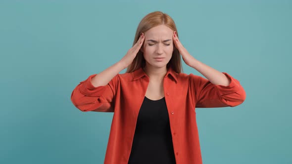 Headache. Young Woman Feeling Pain, Holding Her Head with Hand.