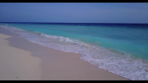 Aerial landscape of beautiful seashore beach voyage by shallow lagoon with white sandy background of