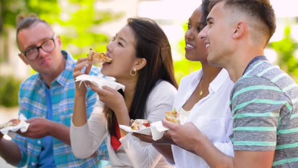 Friends Eating Pizza, Sandwich or Burger in Park