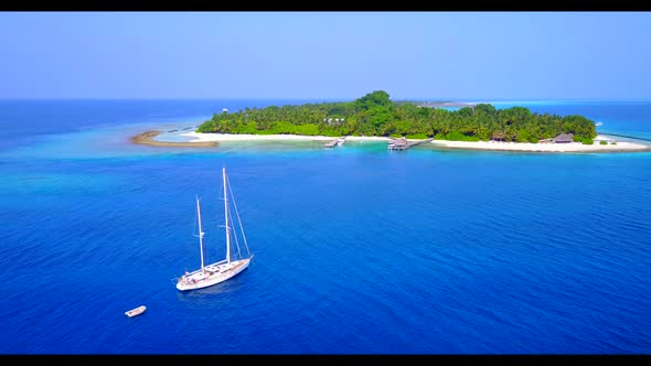 Aerial drone view scenery of tranquil shore beach journey by clear ocean and bright sand background 