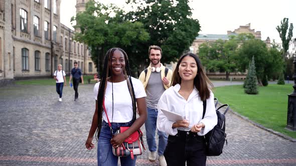 Joyful Multiracial Students Spending Time Outdoor