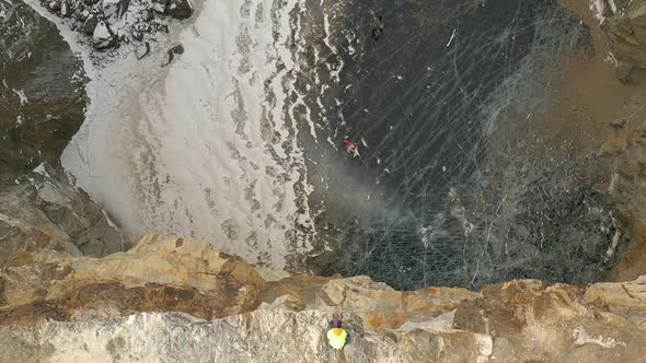 Man Has an Amazing Time Bungee Jumping in Tuimsky Failure in Khakassia. Slow Motion, Aerial View.