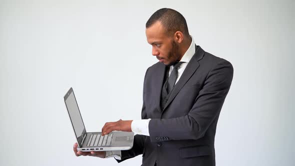 Professional African-american Business Man Holding Laptop Computer