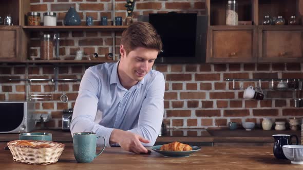 Businessman Shooting His Croissant Use Smart Phone