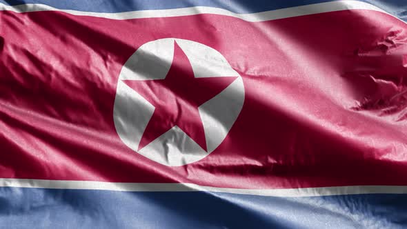 North Korea textile flag waving on the wind. Slow motion. 20 seconds loop.