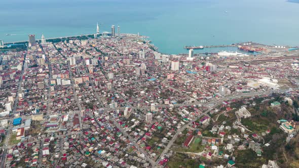 Aerial hyperlapse of International Marine Station pier in Batumi city. Black Sea harbor and bay