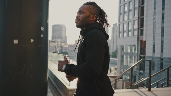 Close Up Portrait of Active Sporty Man Enjoying Morning Run Practice at Urban Area in City Cinematic