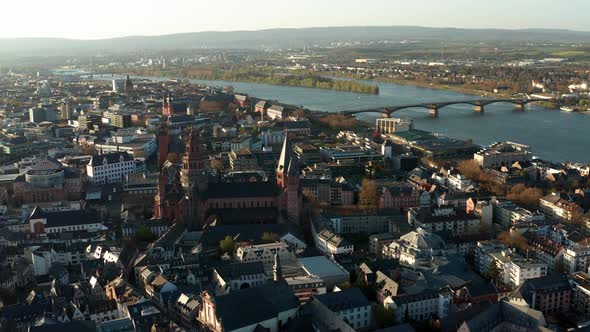 Slow drone shot around Mainz the red Cathedral church in the middle of the old town with the Rhine r
