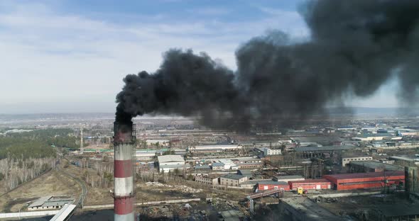 Coal-fired Smokestack Releasing Black Smoke Into the Air