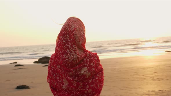 Young Women Wearing a Red Saree on the Beach Goa India