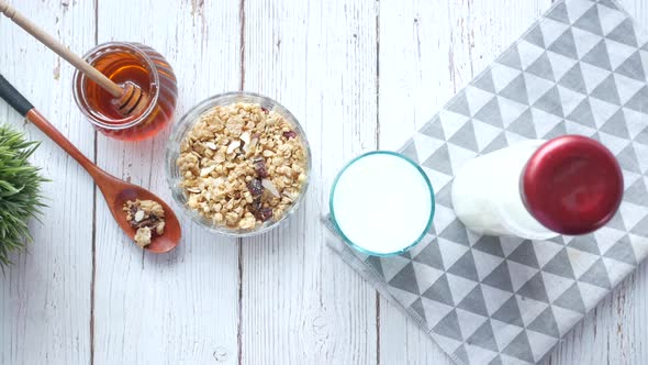 Cereal Breakfast in Bowl Bread and Honey on White Background