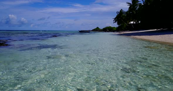 Natural birds eye copy space shot of a white sandy paradise beach and aqua turquoise water backgroun