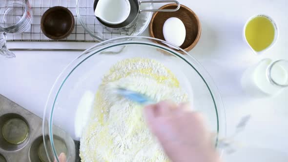 Step by step. Preparing traditional sweet cornbread from organic ingredients.
