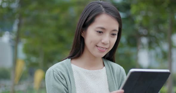 Woman use of tablet computer in the city