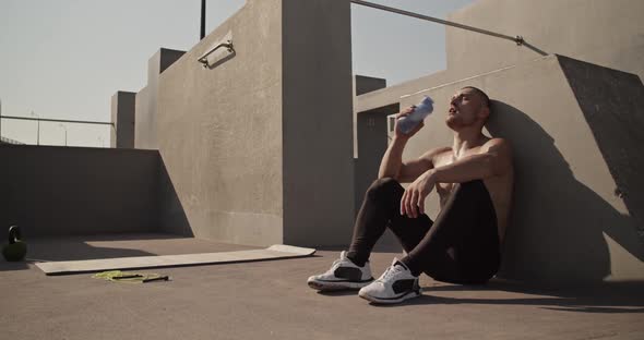 Sportsman Drinking Water on Sports Ground