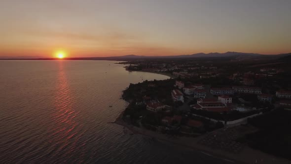 Aerial Shot of Greek Resort on Sea Coast, View at Sunset