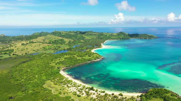 A Tropical Island with a Turquoise Lagoon and a Sandbank. Caramoan Islands, Philippines.