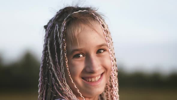 Portrait of a Cute Teenage Girl with African Braids