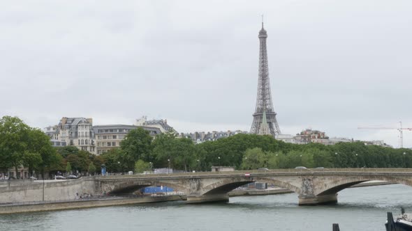 Famous Eiffel tower and Alexander III bridge golden statues in Paris France 4K 2160p UltraHD tilt fo