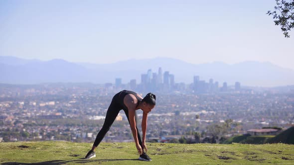 Mixed ethnicity woman Exercising in a park in Los Angeles
