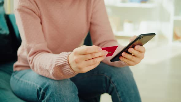 Asian Woman Using Credit Card and Smartphone Shopping in App