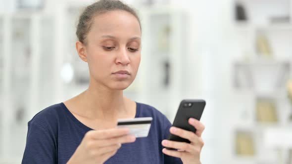 Portrait of African Woman Having Unsuccessful Online Payment on Smartphone 