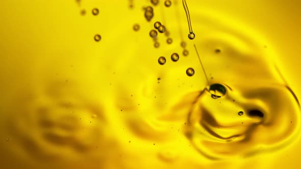 Super Slow Motion Shot of Pouring Golden Oil Liquid at 1000Fps