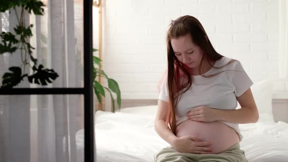 Pregnant Expectant Mother Caressing Her Belly