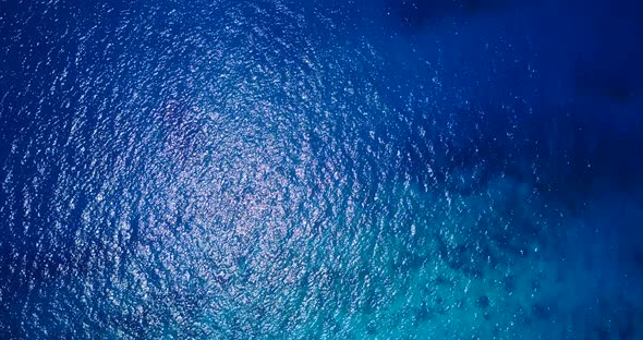 Wide above tourism shot of a summer white paradise sand beach and aqua blue ocean background in best