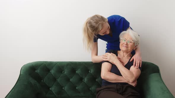 Young Caregiver Woman Supporting Her Elderly Grandmother