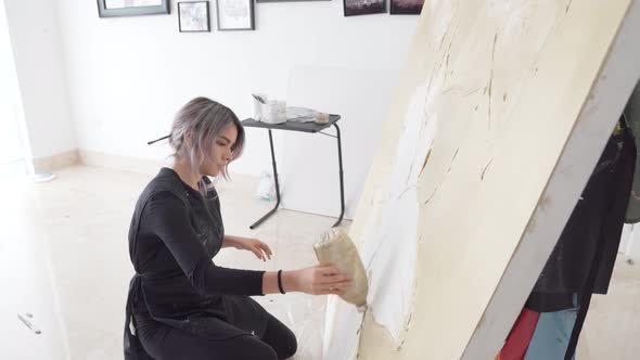 Innovative Artist Creating An Abstract Large Canvas In Studio At Daytime. - High Angle Shot