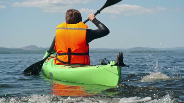 Male Tourist Enjoying Kayaking