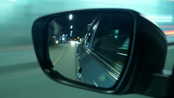 4k driving reflection from car side mirror