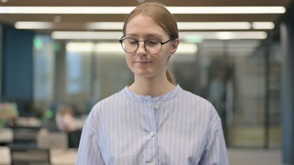 Portrait of Young Woman Shaking Head As No Sign Denial