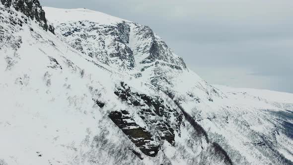 Snow Covered Mountains In Manndalen, Northern Norway. Aerial Drone Shot